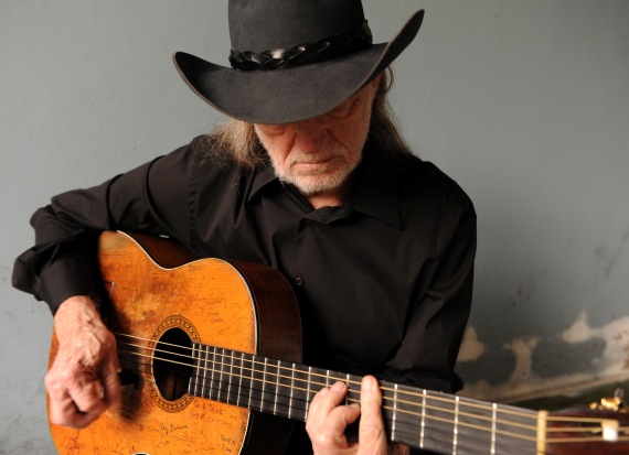 Willie Nelson with guitar, country legend